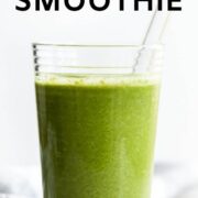 Tall glass of green smoothie.
