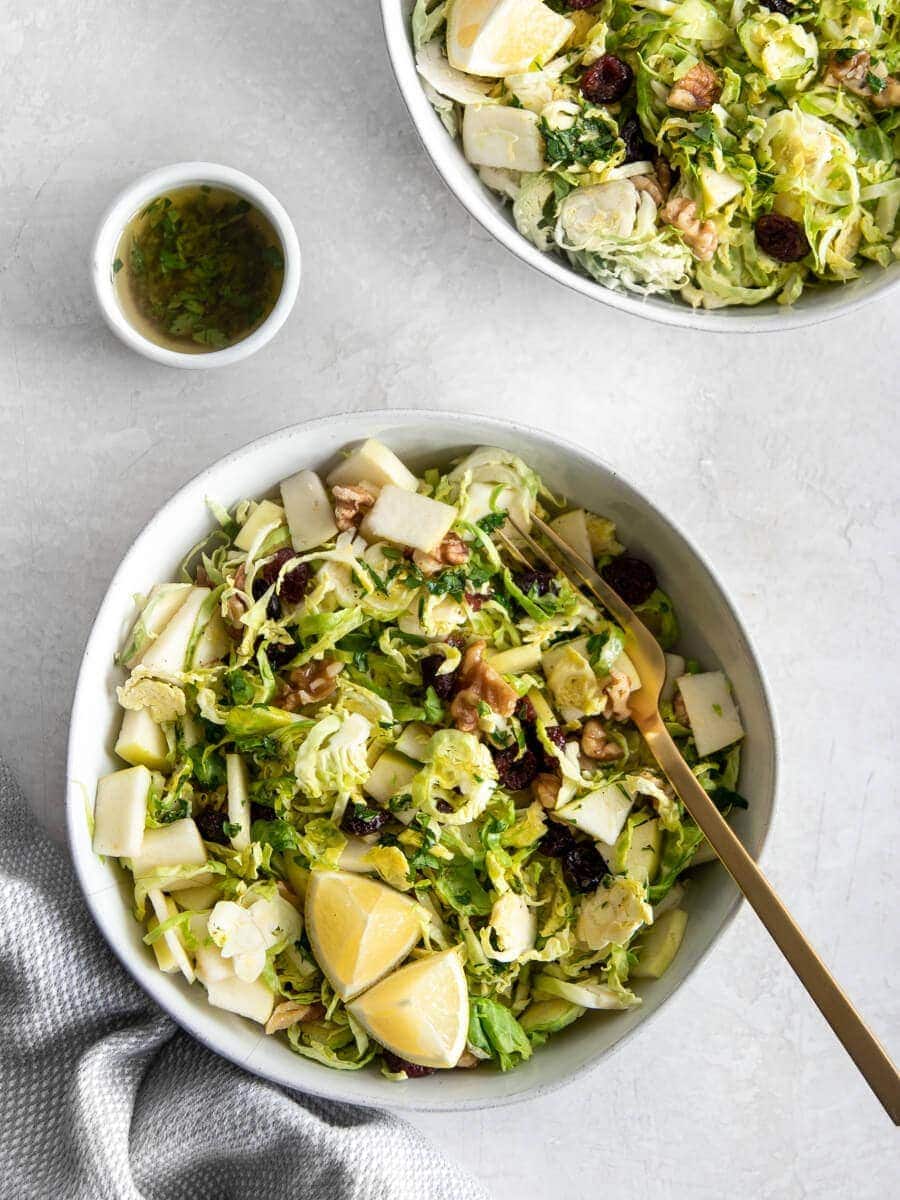 Two bowls of shaved brussels sprout salad