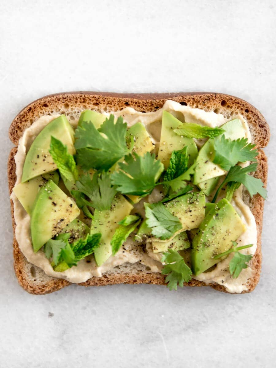 Avocado hummus toast with cilantro