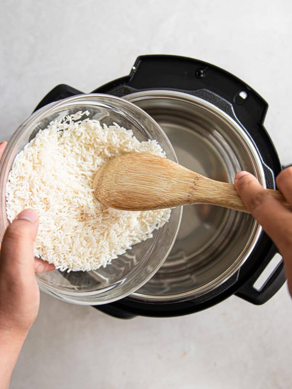 Adding rinsed Basmati rice to Instant Pot.