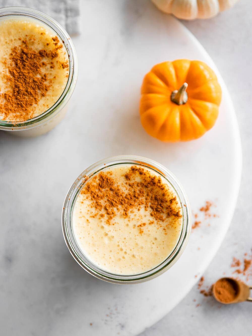 Two glasses of pumpkin chai smoothie