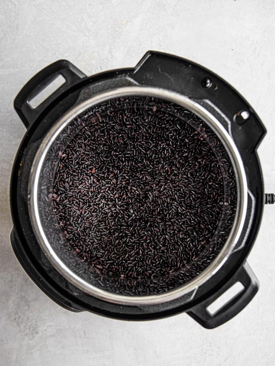 An Instant Pot filled with cooked black rice
