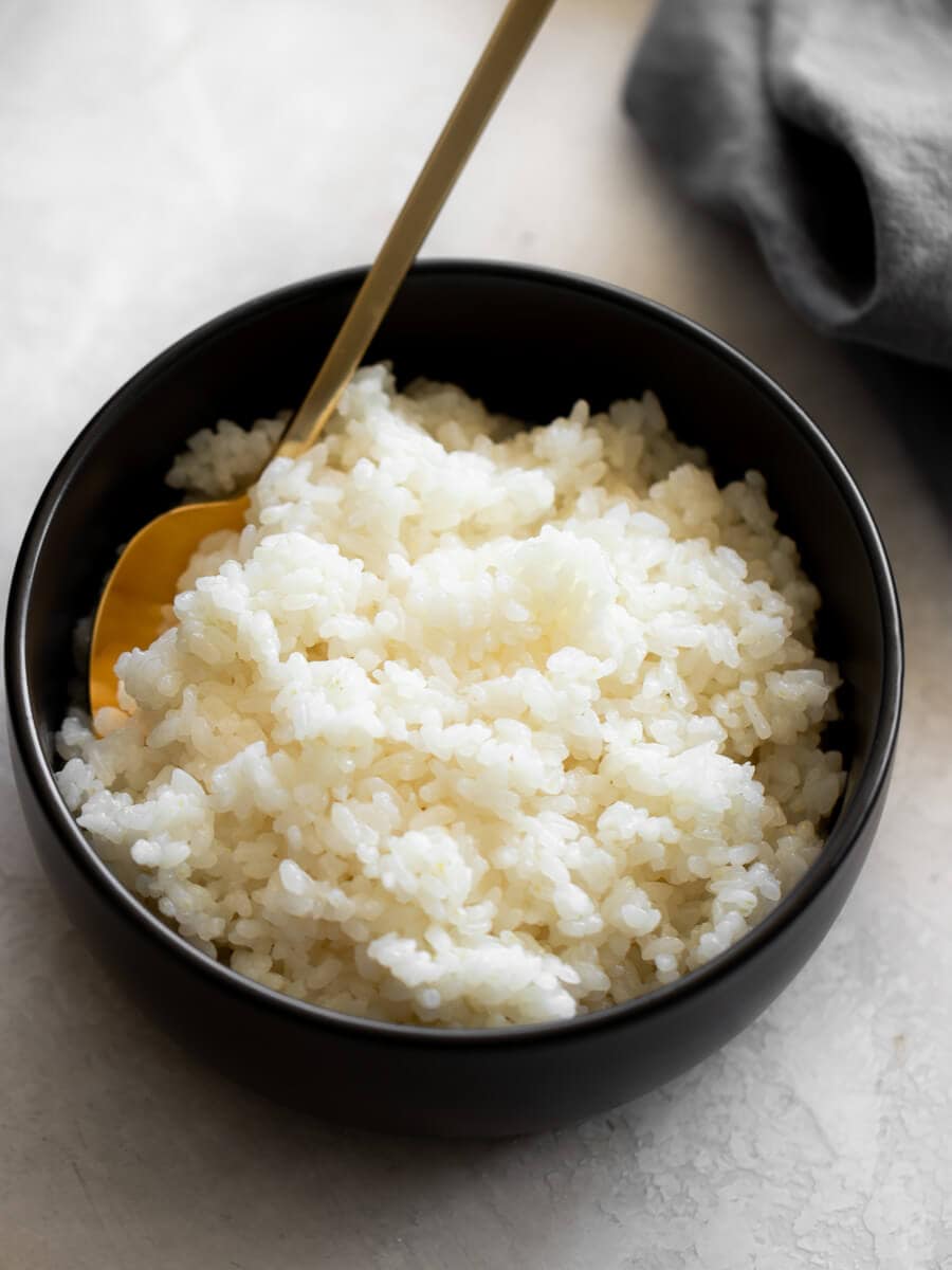 Bowl of rice with a spoon in it