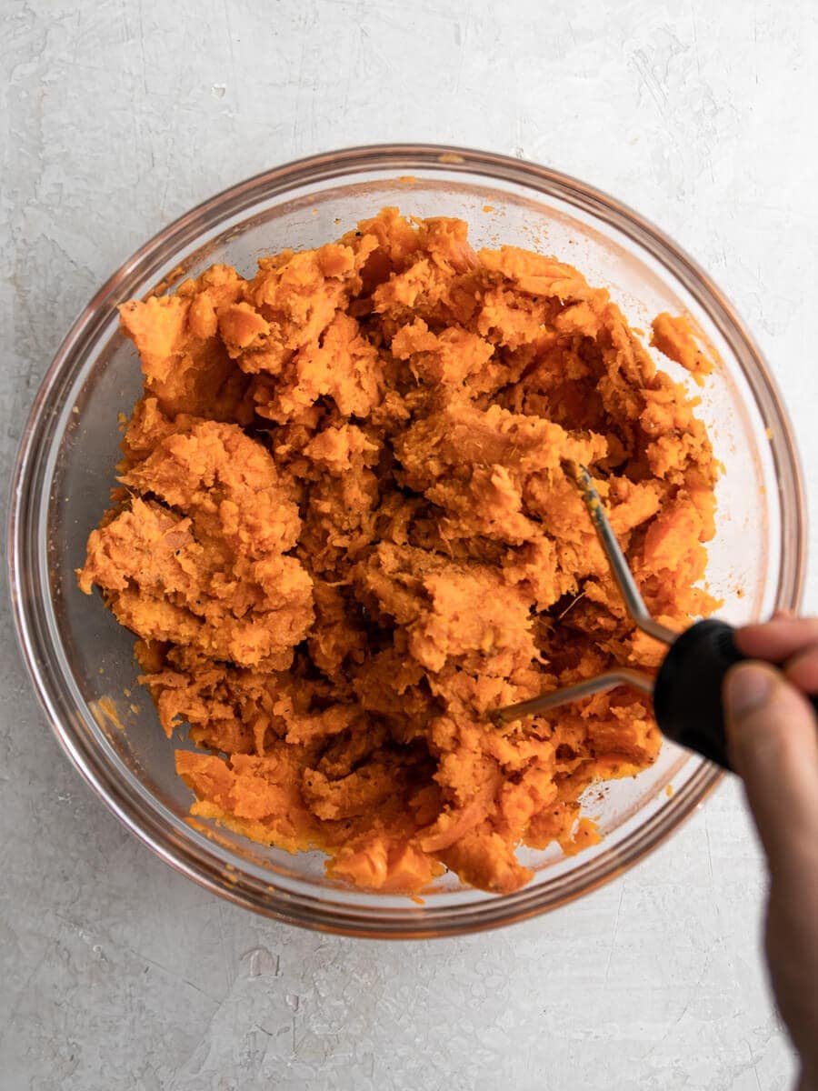 Almost mashed sweet potatoes in a bowl
