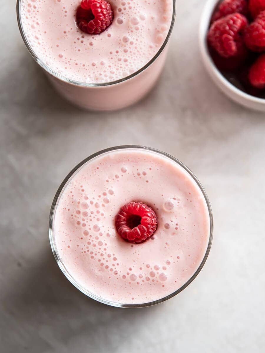 Two glasses of raspberry smoothie.