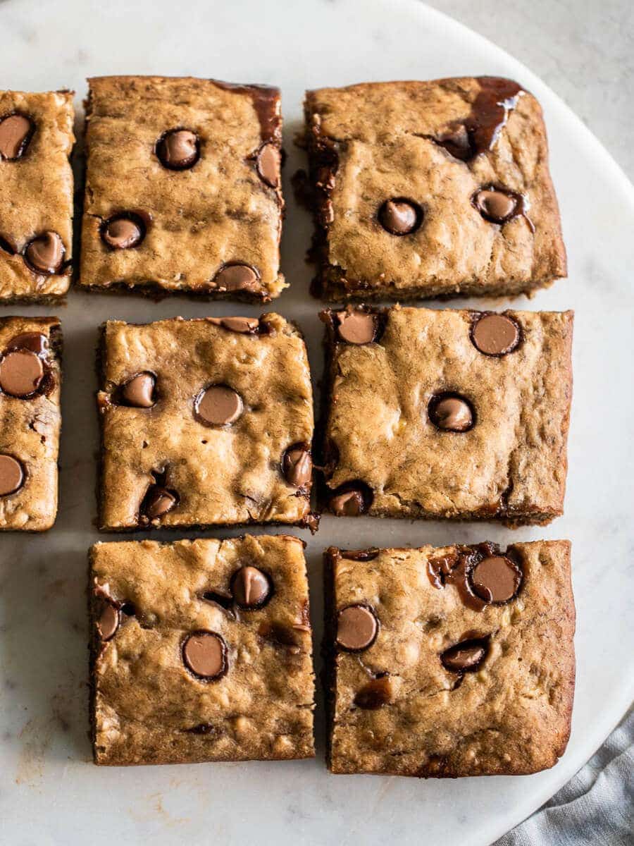 Banana chocolate chip bars sliced and placed on marble platter.