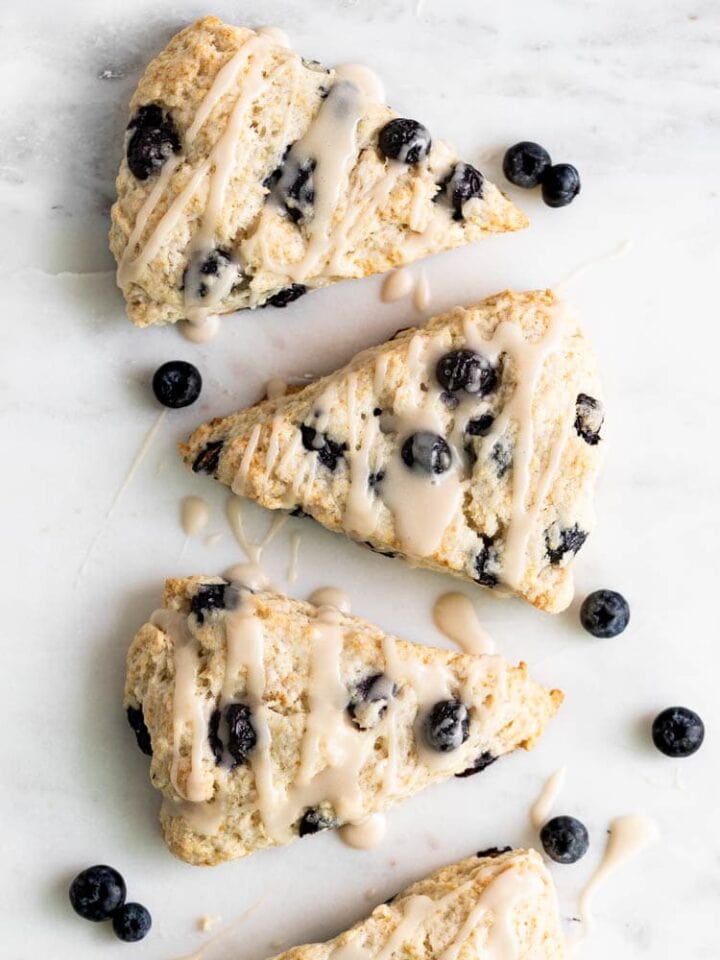 Three vegan blueberry scones on a platter