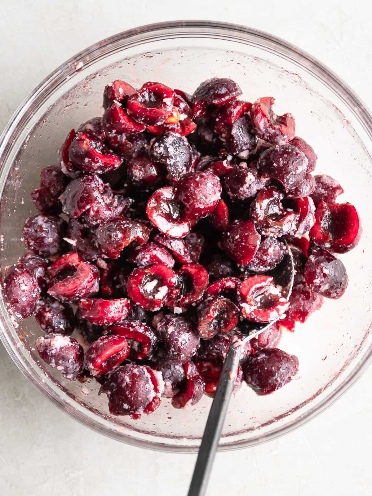 Bowl of cherries mixed with other other ingredients.