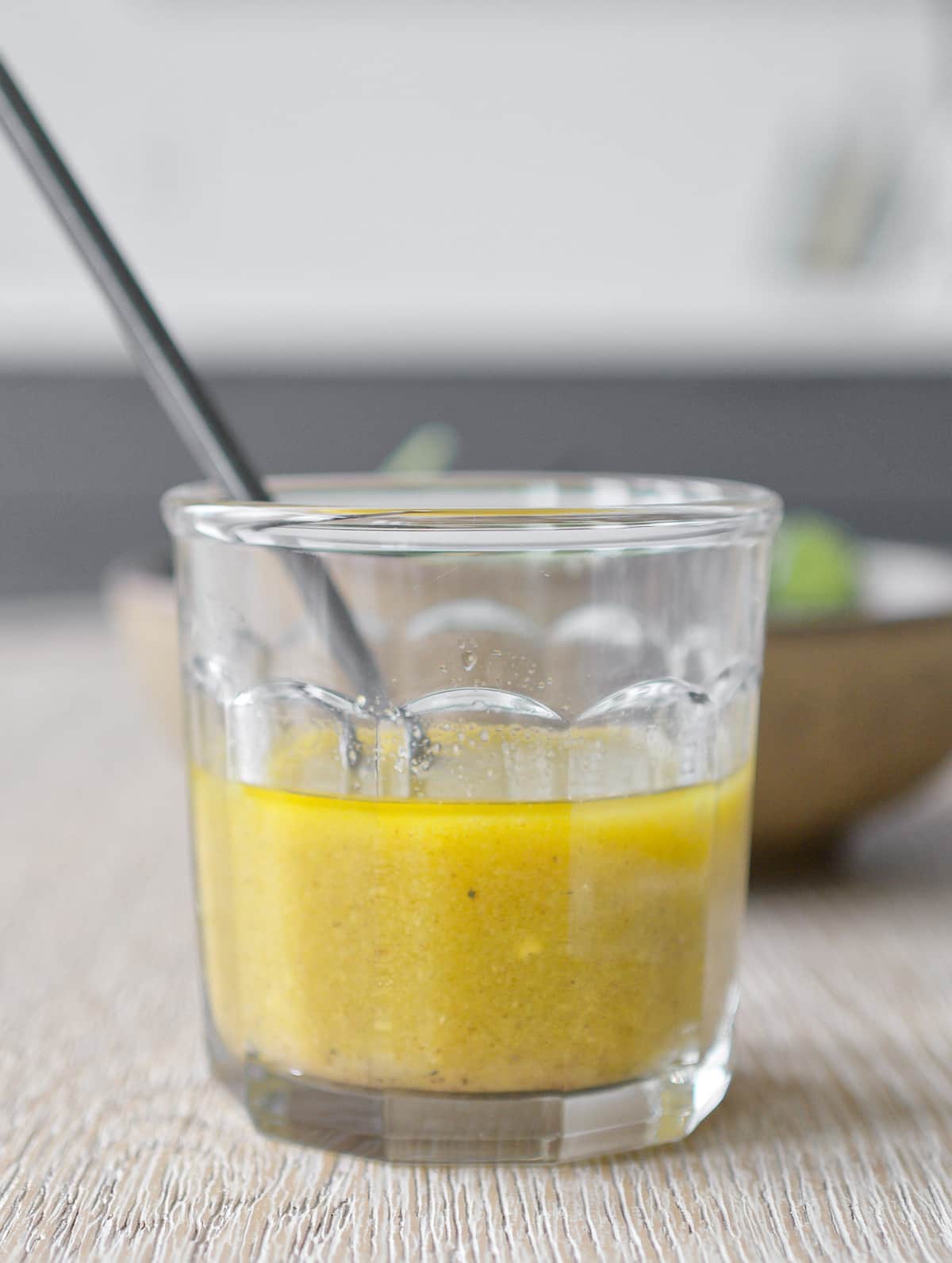 Apple cider vinegar dressing in glass jar.