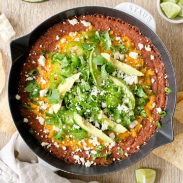 Black bean dip with garnishes.