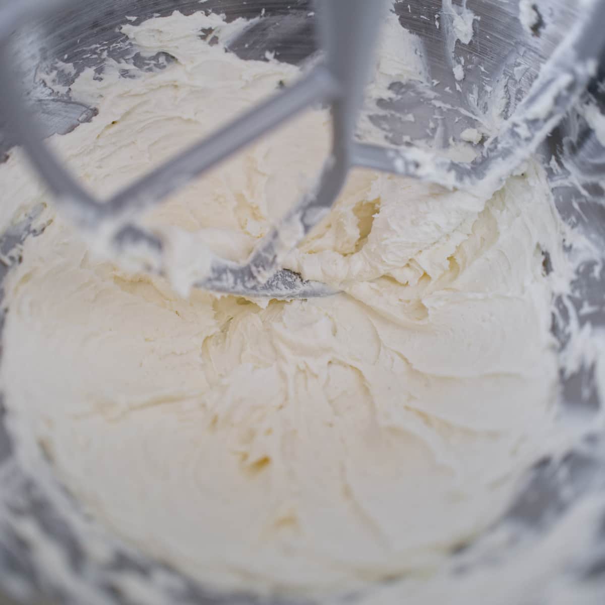 Whipped cream cheese in stand mixer.