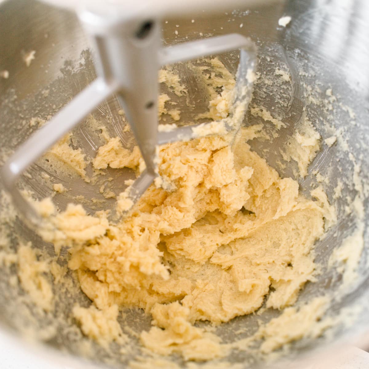 Creamed butter and sugar in kitchen stand mixer.