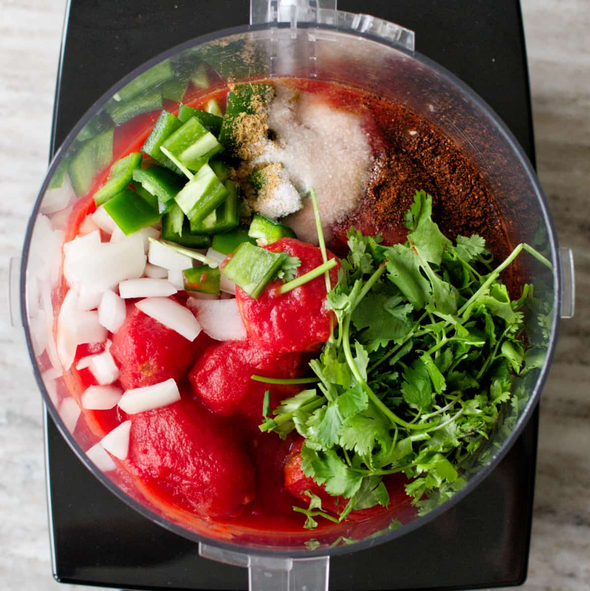 Salsa ingredients in the food processor.