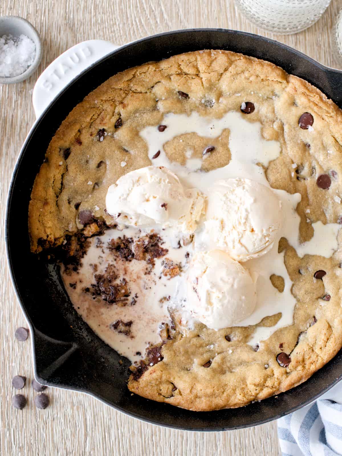 Skillet chocolate chip cookie with melted ice cream.