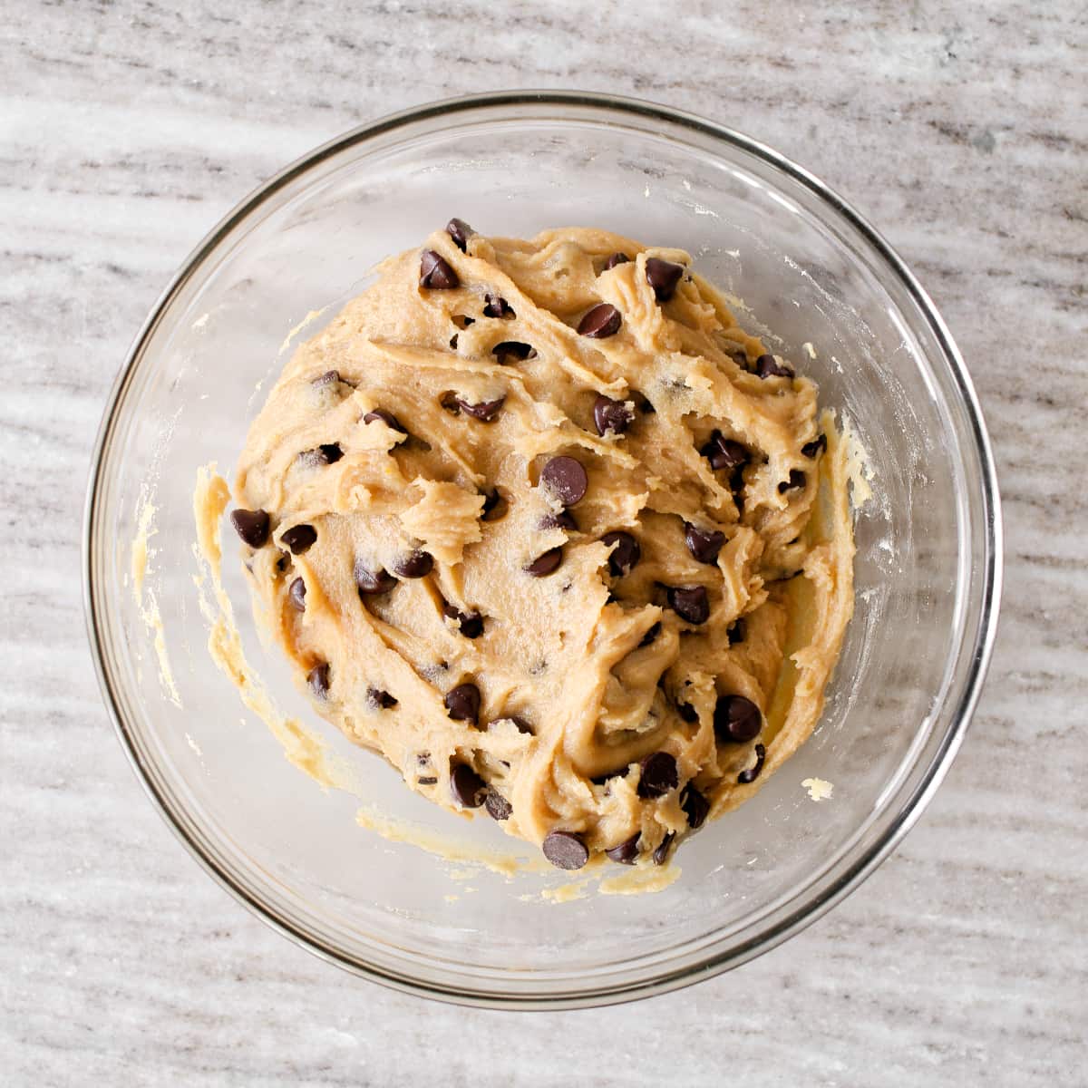 Chocolate chips folded into batter in large mixing bowl.