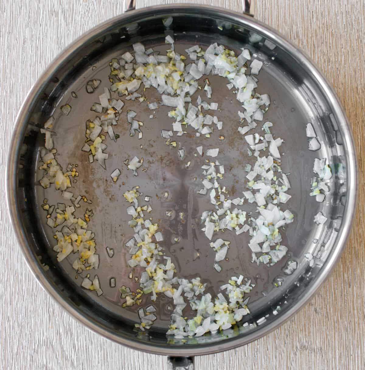 Aromatics cooking on pan.