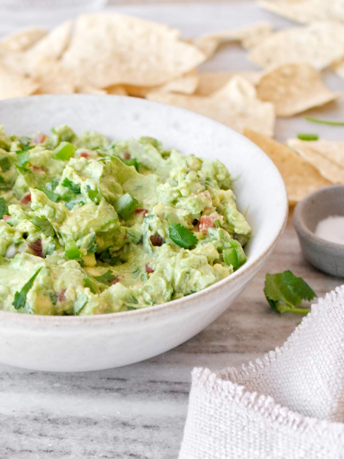 Close-up of bowl of guacamole and tortilla chips.