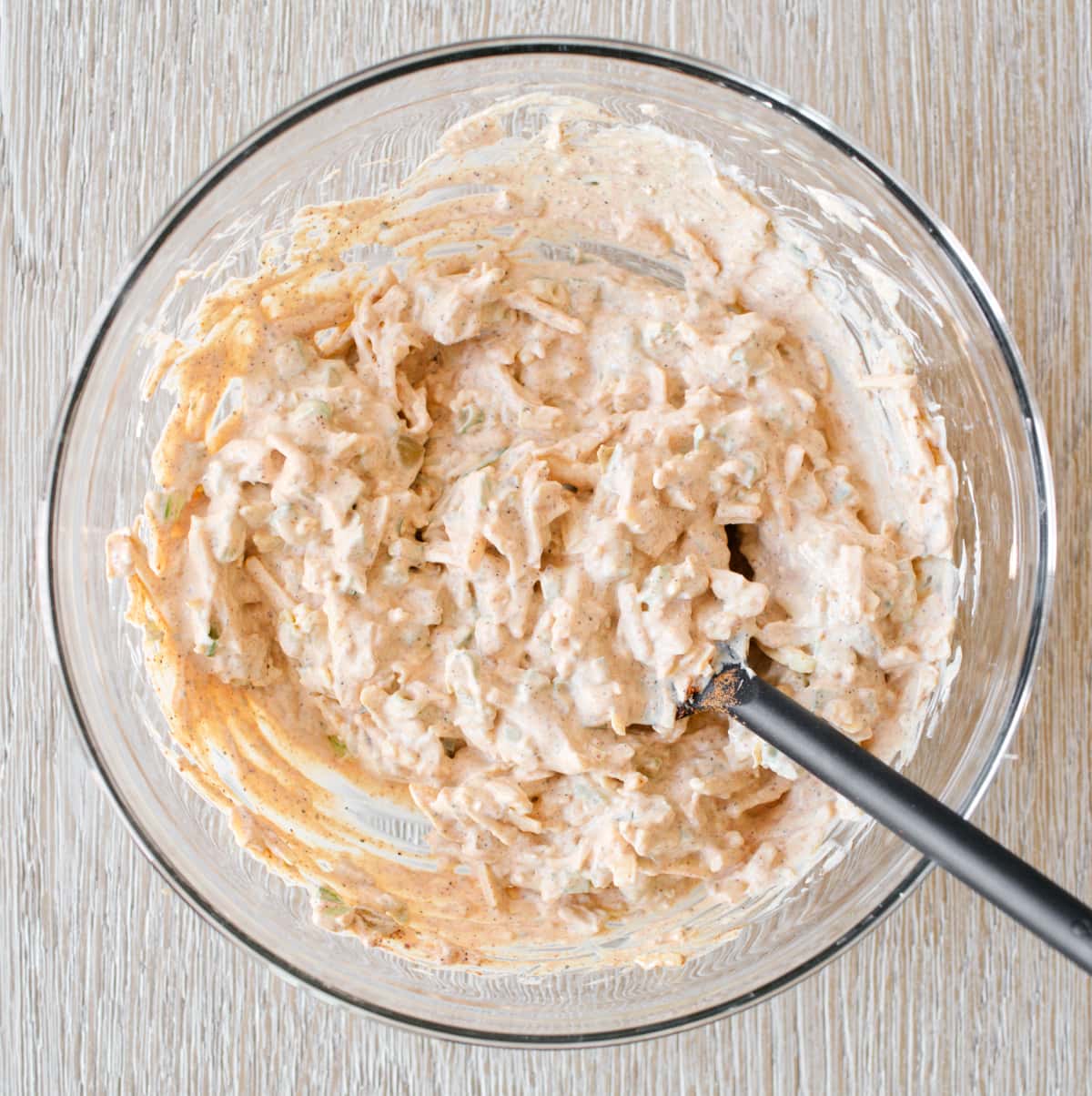 Mixture of cheddar cheese and corn dip ingredients.