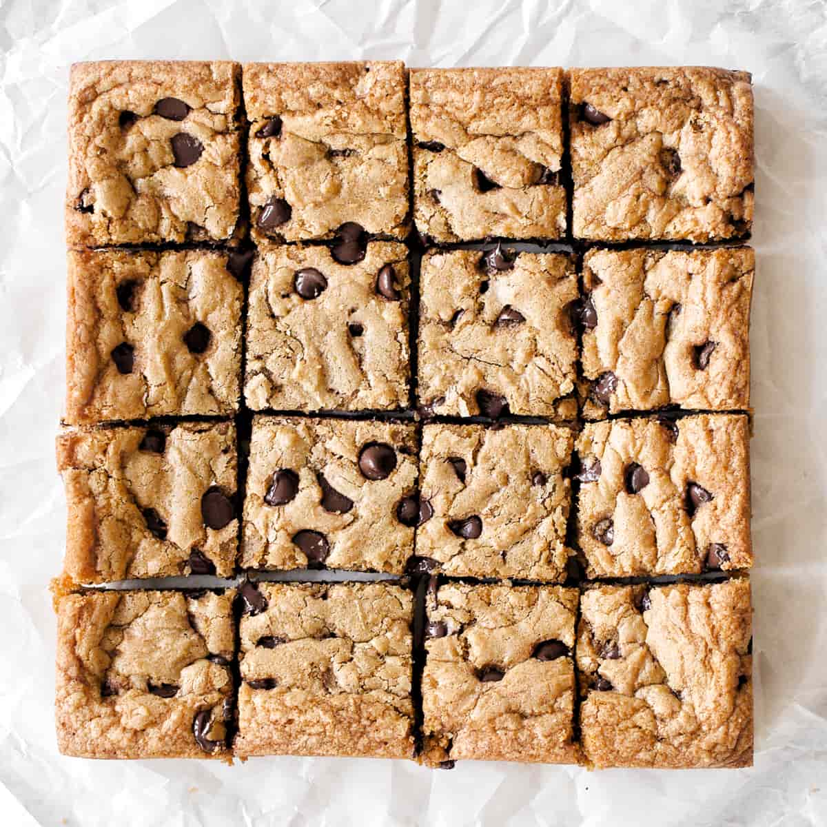 Chocolate chip cookie bars sliced into 16 pieces.