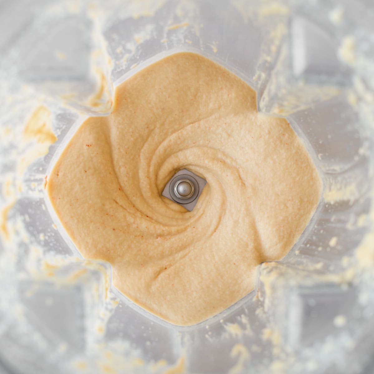 Processed hummus in blender.