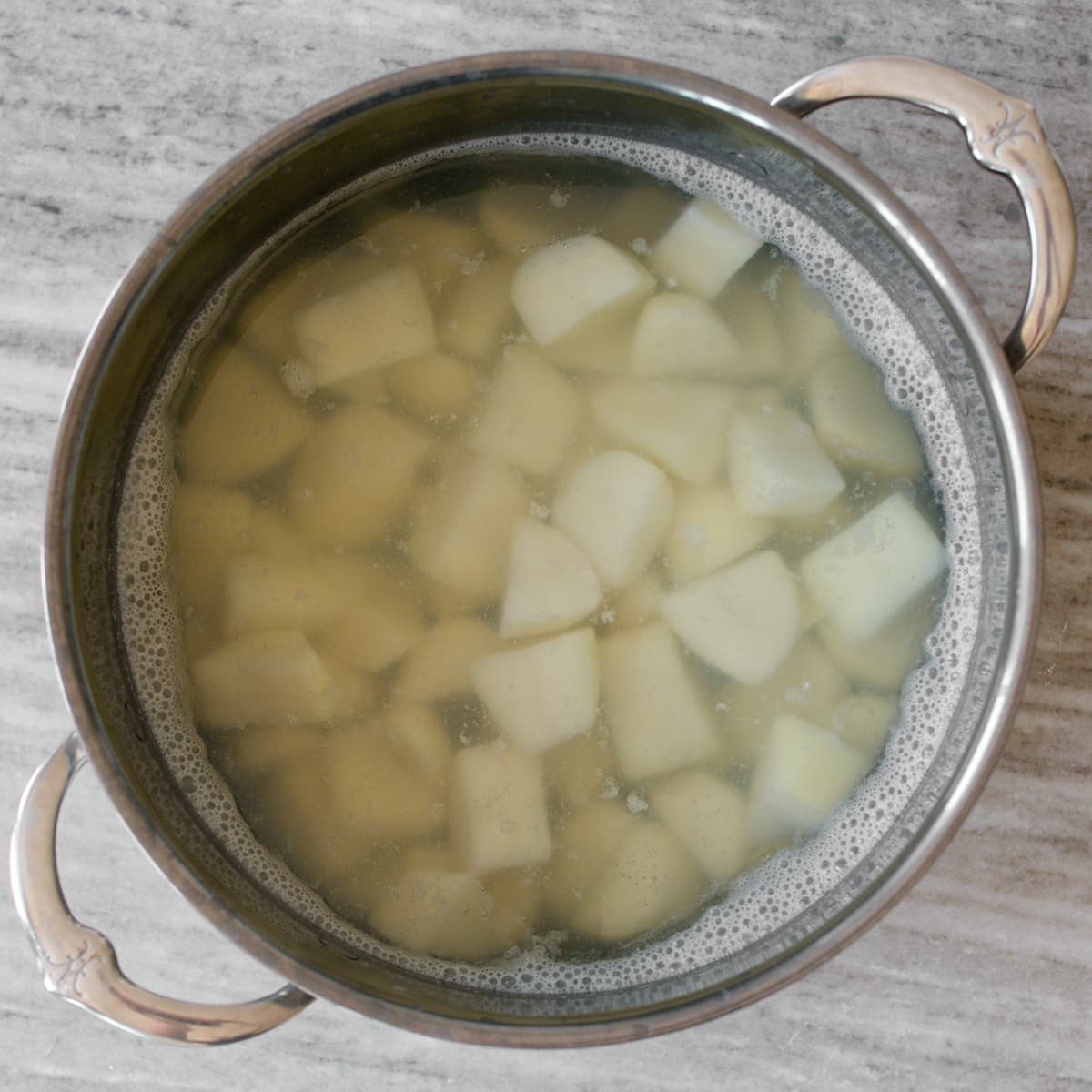 Boiled potatoes in large pot.
