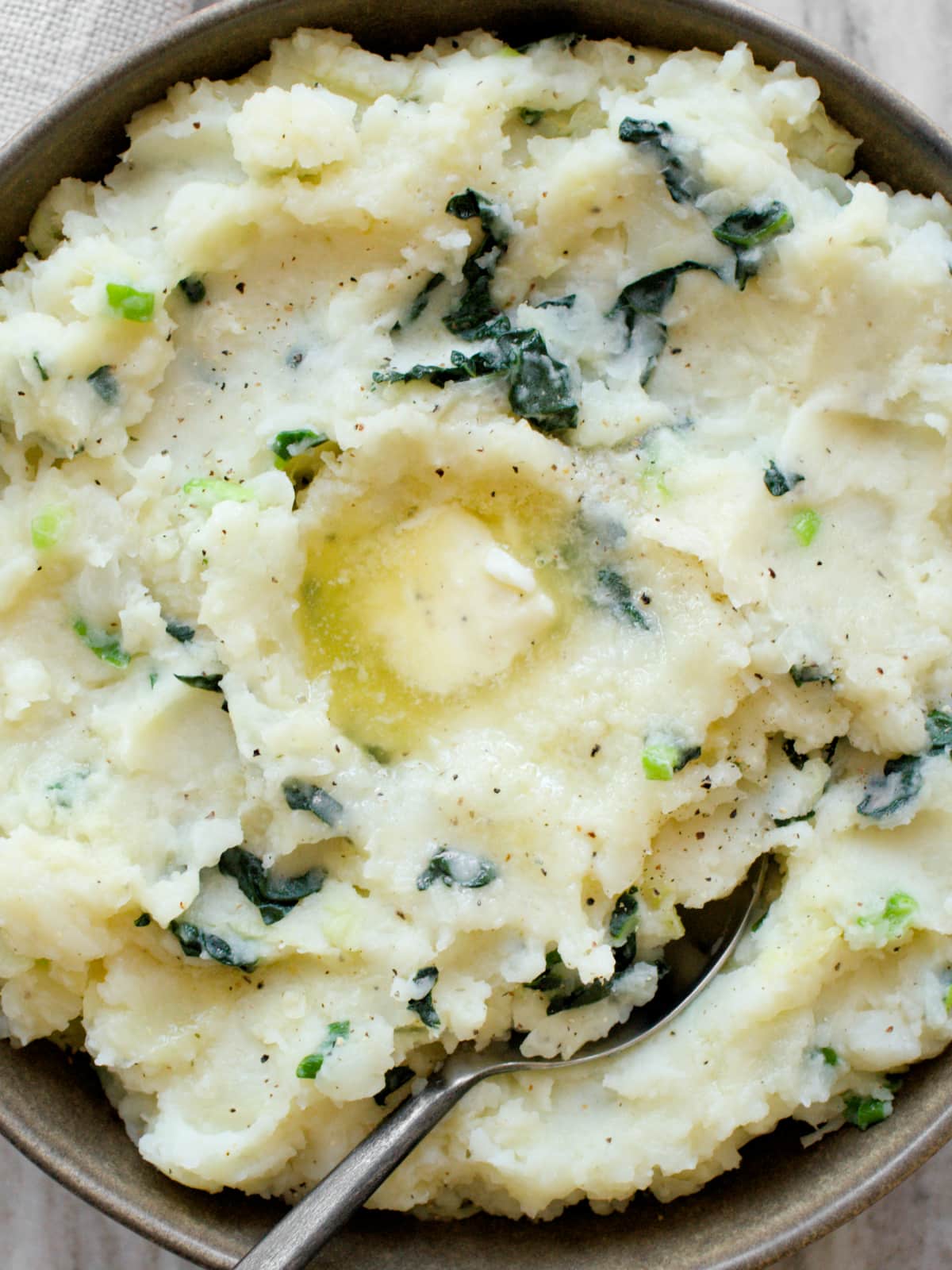 Close-up of colcannon with knob of butter.