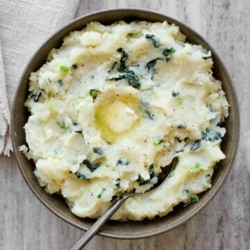 Colcannon in serving bowl with a knob of butter.