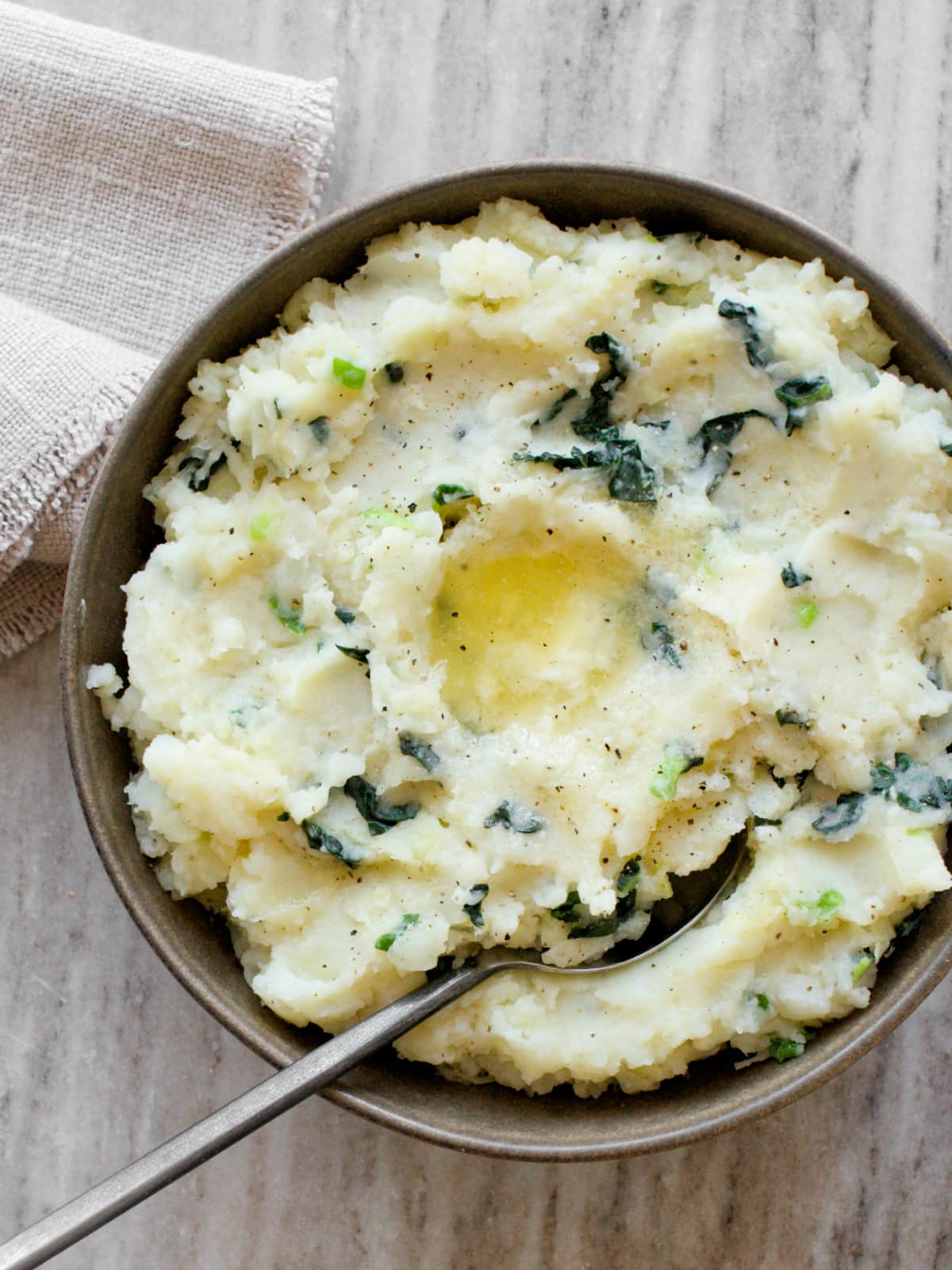 Bowl of colcannon and a napkin.